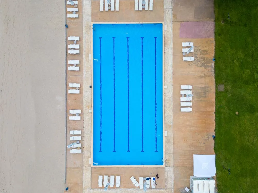 An Aerial View Reveals An Empty Pool Devoid Of Swimmers