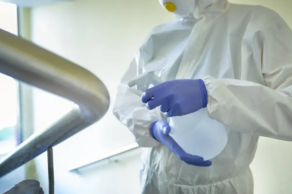Close up of surface disinfection with a spray bottle
