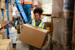 Warehouse worker preparing bulk chemical supplies for distribution